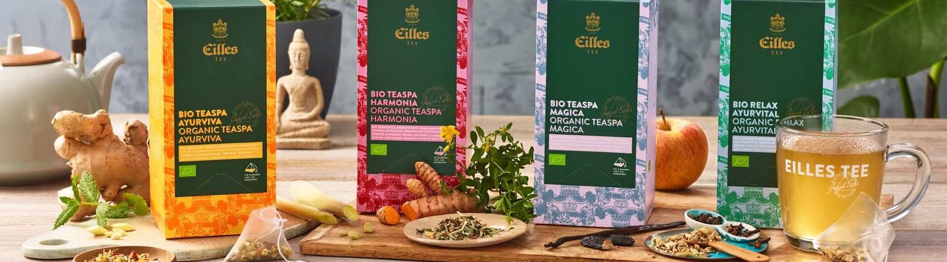 Organické ajurvédske zmesi Eilles Tea, vrátane Relax, Magica a Harmonia, zobrazené s čerstvými prísadami.