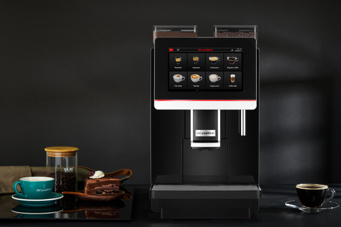 Elegantní kávovar Dr. Coffee s dotykovým displejem, druhy kávy a dezertem, ideální pro milovníky kávy a kavárny.