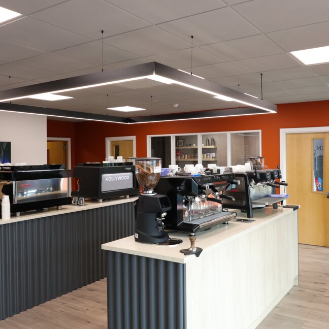 Modern coffee shop interior featuring stylish equipment and an inviting atmosphere, ideal for coffee lovers and baristas.