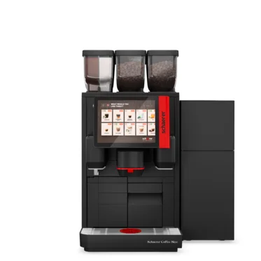 Ekspres do kawy Schaerer z czerwonymi akcentami, wyposażony w ekran dotykowy i trzy pojemniki na kawę ziarnistą do specjalistycznego parzenia.