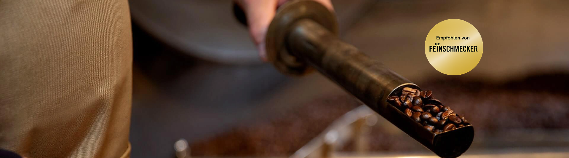 Freshly roasted coffee beans being poured from a roasting tool, showcasing a passion for quality coffee preparation.