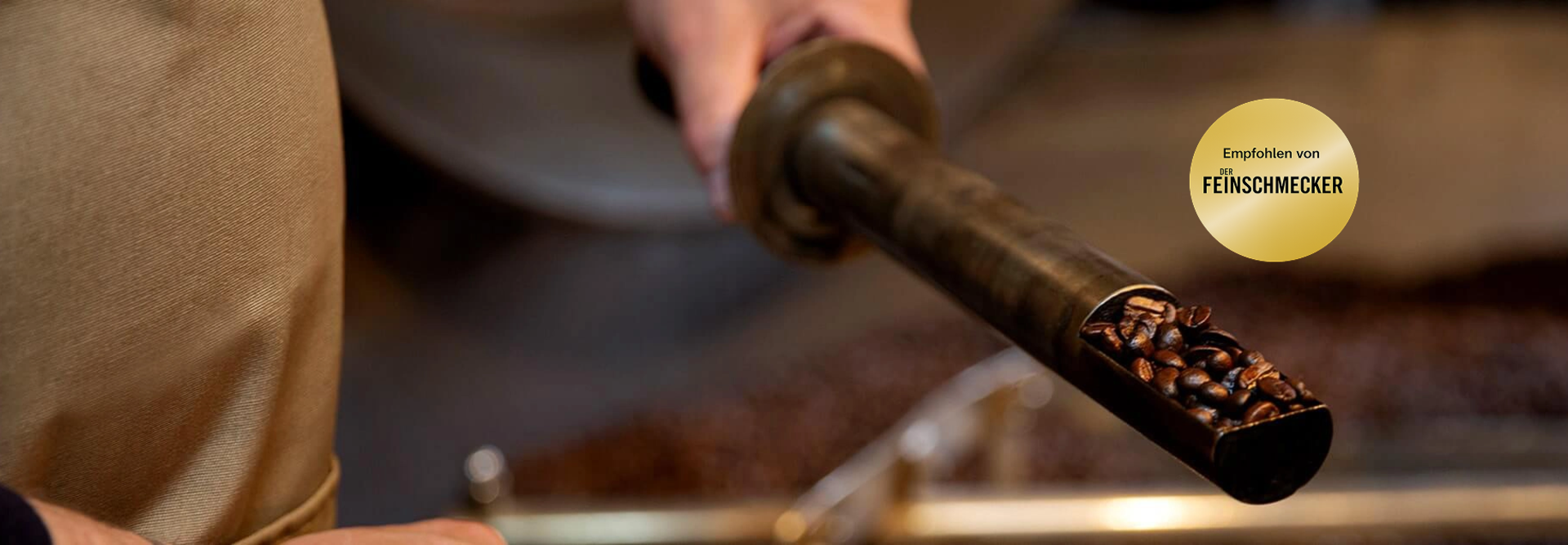 Freshly roasted coffee beans being poured from a roasting tool, showcasing a passion for quality coffee preparation.