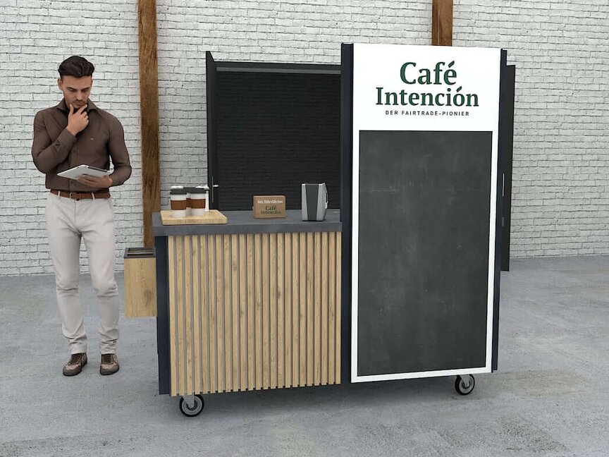 Stilvolle Café-Theke des Café Intención mit einem Mann, der in einer modernen, minimalistischen Umgebung Notizen prüft.