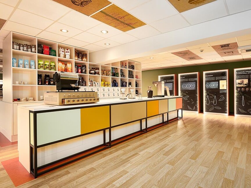 Bright, modern café showcasing a variety of coffee products and brewing equipment, perfect for coffee enthusiasts.