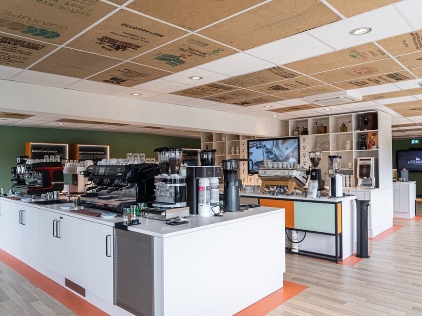 Modern coffee training centre featuring advanced brewing equipment and a stylish, open design for educational sessions.