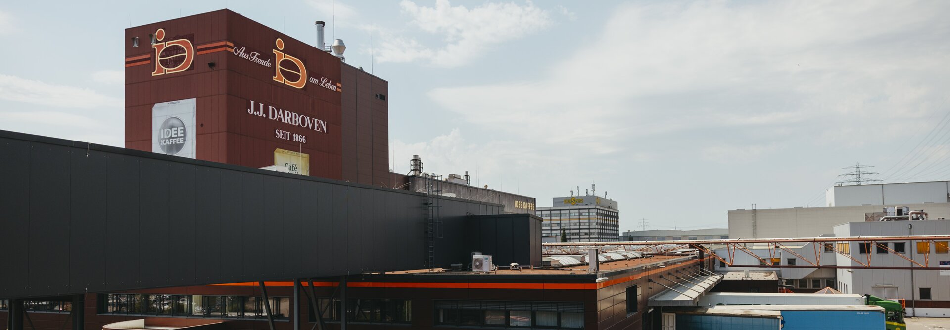 J.J. Darboven facility in Germany, showcasing the company’s modern architecture and vibrant branding.