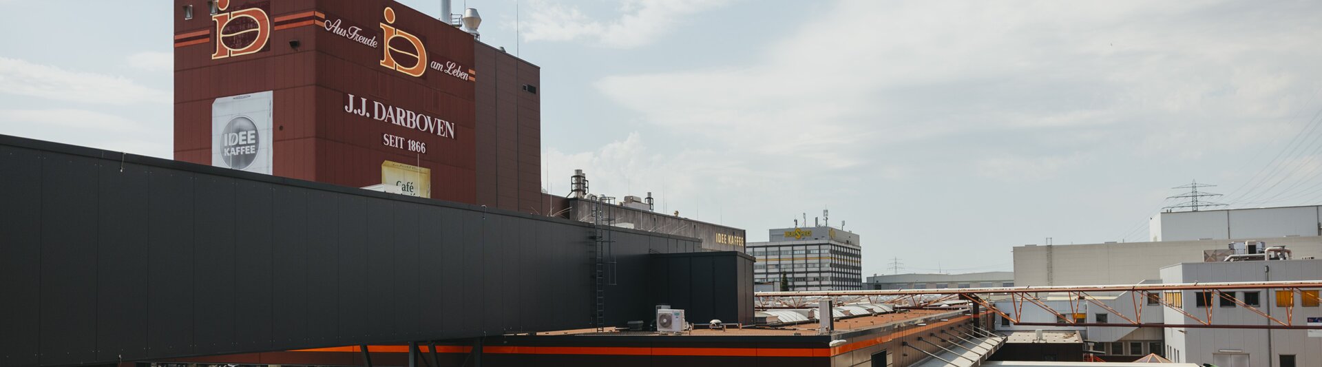 J.J. Darboven facility in Germany, showcasing the company’s modern architecture and vibrant branding.